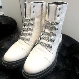 White combat boots with silver chain detail